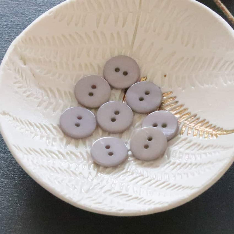 Flat mother-of-pearl buttons with 2 holes