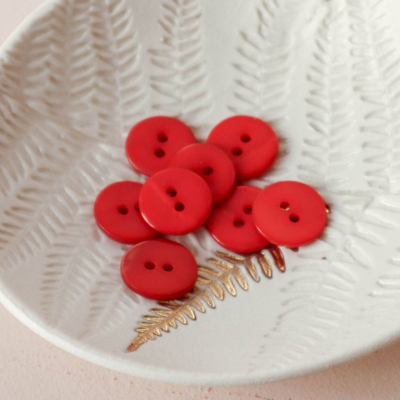 Flat mother-of-pearl buttons with 2 holes
