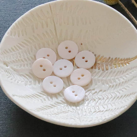 Flat mother-of-pearl buttons with 2 holes