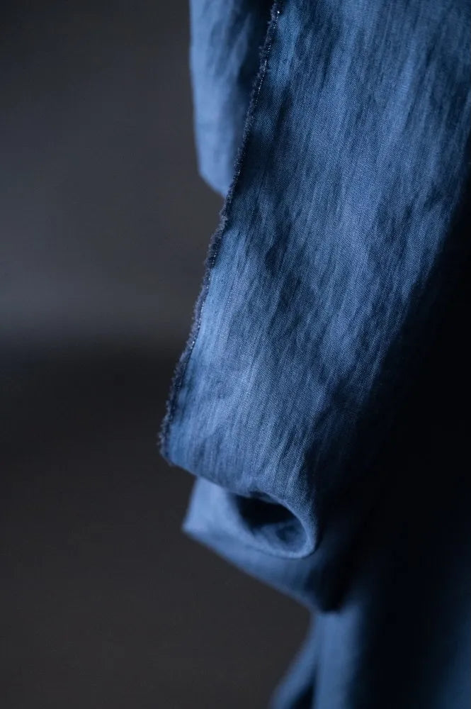 Close-up of a textured fabric with a dark background