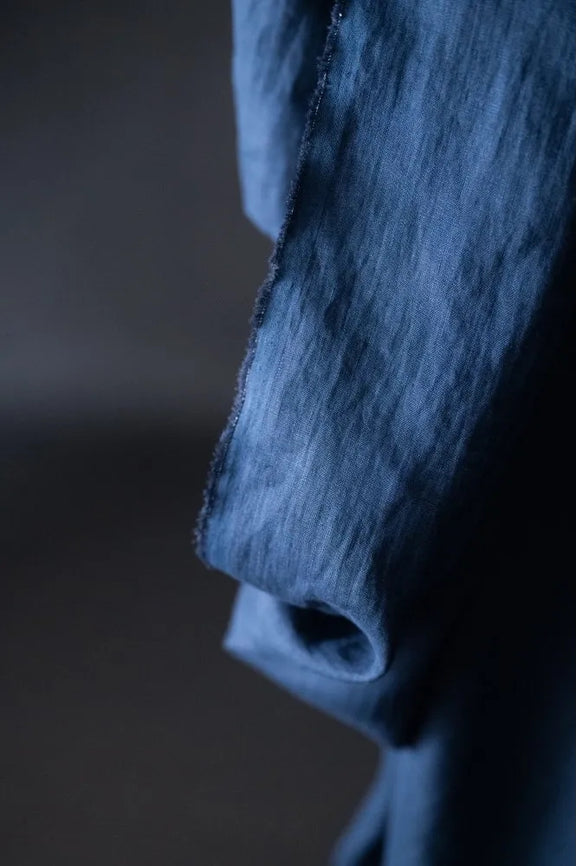 Close-up of a textured fabric with a dark background