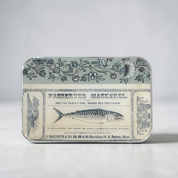 Vintage-style metal tin with preserved mackerel label on a light gray background